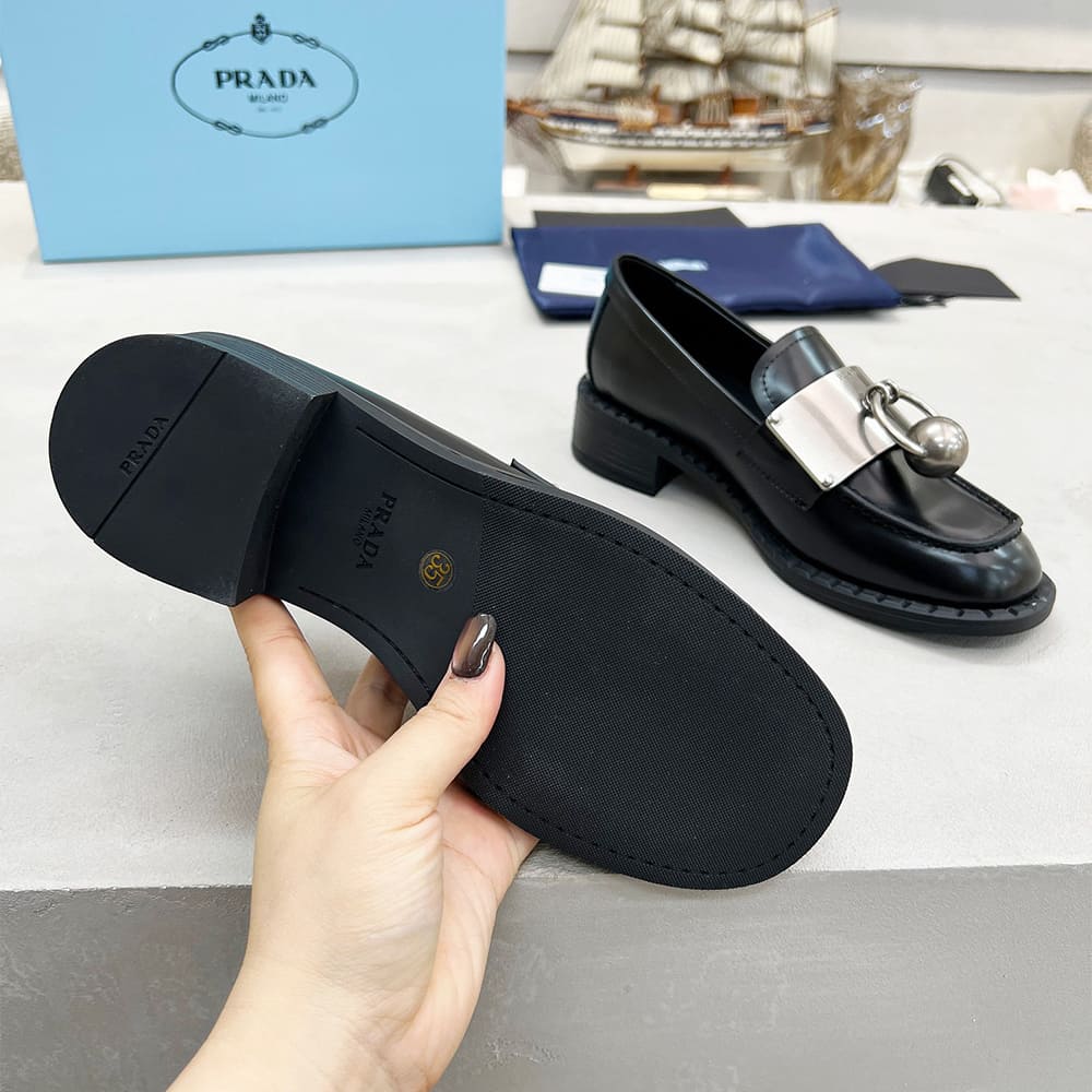 PRADA Brushed leather loafers with metal details